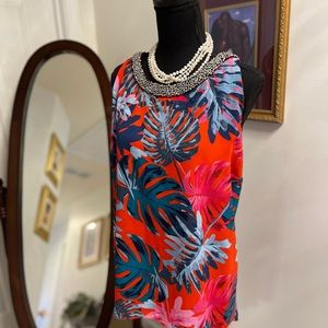 Jennifer Lopez Crystal Collar Sleeveless flowy trapeze top.